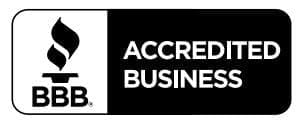 A black and white image of an accredited business logo.